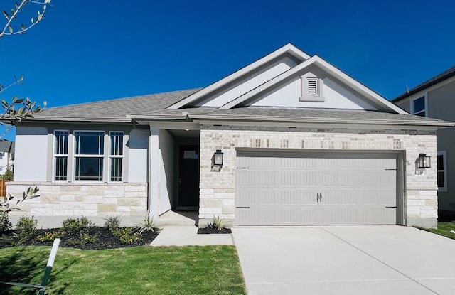 544 Raleigh Dr, Georgetown, TX 78633 - view of front of property with stone siding, an attached garage, driveway, and roof with shingles