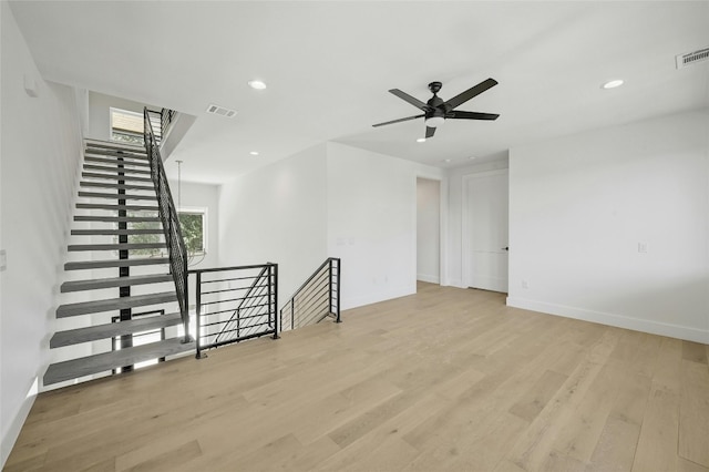 empty room featuring light hardwood / wood-style flooring and ceiling fan