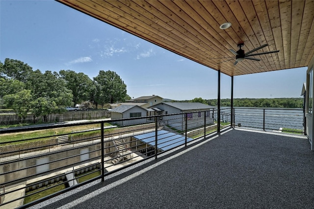 view of patio featuring ceiling fan and a balcony