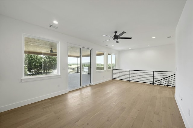 unfurnished room with light hardwood / wood-style flooring and ceiling fan