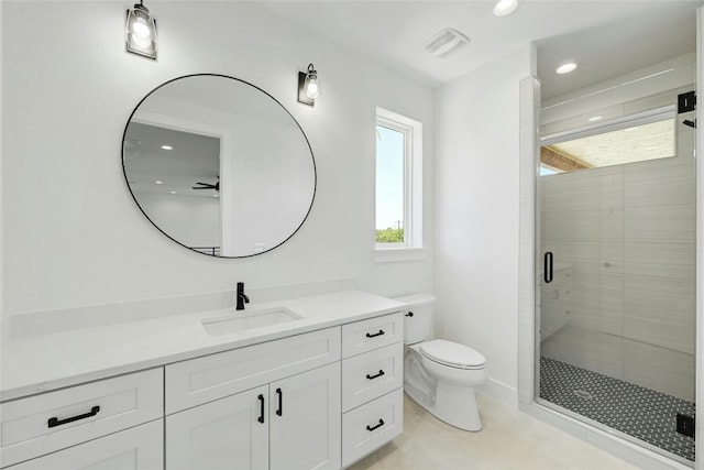 bathroom with walk in shower, tile patterned floors, toilet, and vanity