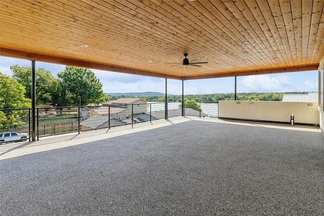 interior space with a balcony and ceiling fan