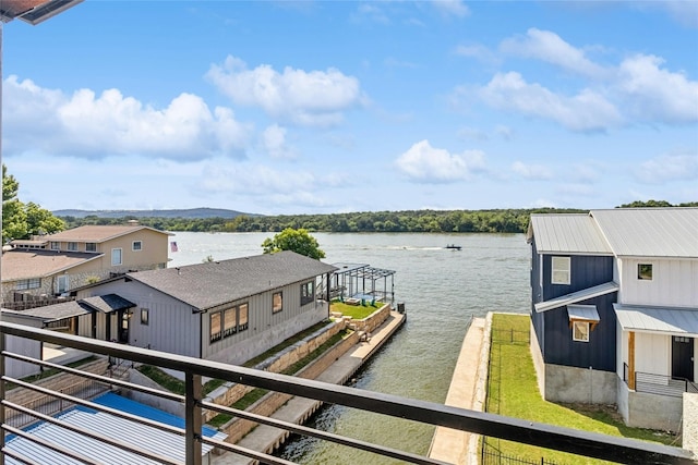 exterior space featuring a dock and a water view