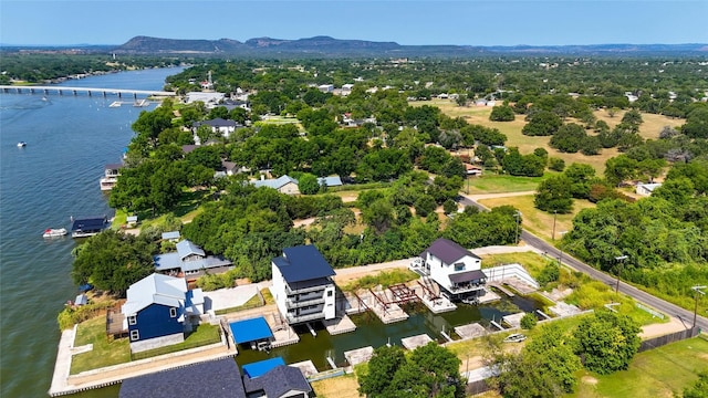 drone / aerial view with a water and mountain view