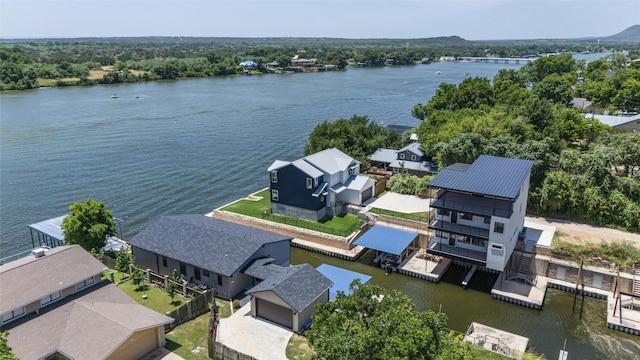 drone / aerial view with a water view and a residential view