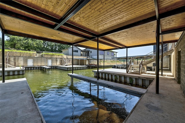 dock area featuring a water view