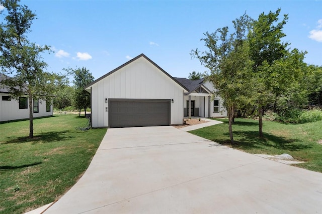 modern farmhouse style home with a garage and a front lawn