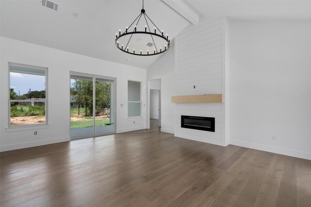 unfurnished living room featuring dark hardwood / wood-style flooring, a wealth of natural light, and high vaulted ceiling