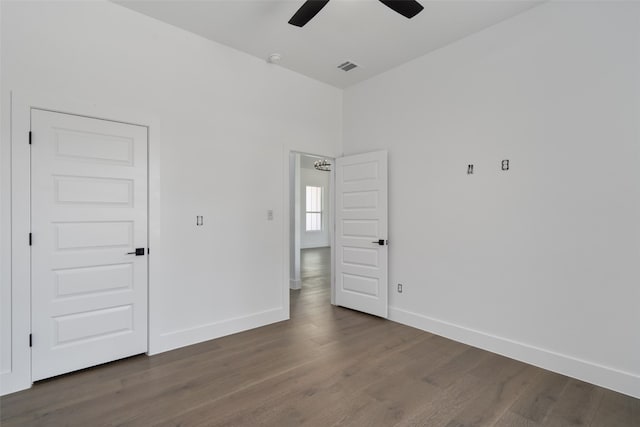 interior space with dark hardwood / wood-style flooring and ceiling fan