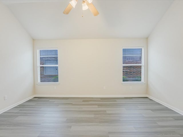 unfurnished room with ceiling fan, lofted ceiling, and light hardwood / wood-style floors