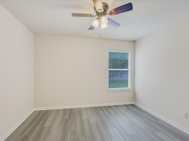 empty room with ceiling fan and light wood-type flooring