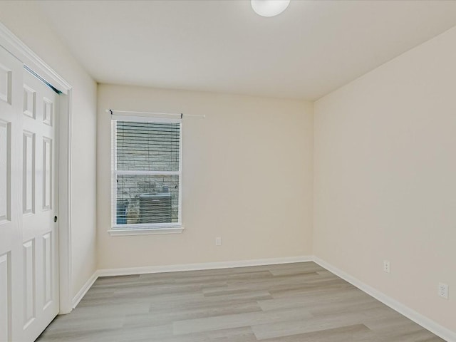 spare room featuring light hardwood / wood-style floors