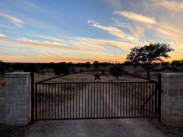 view of gate at dusk