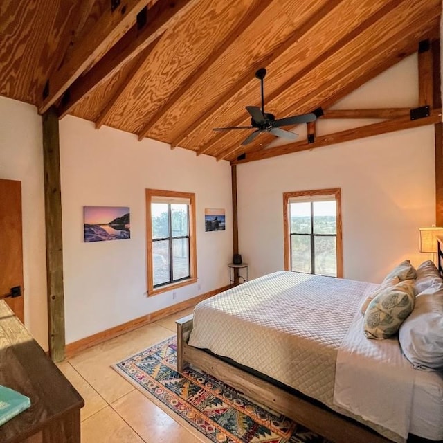 tiled bedroom featuring ceiling fan and lofted ceiling with beams