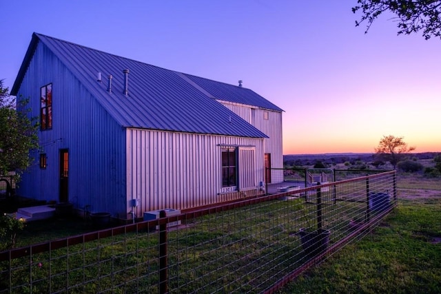 view of property exterior at dusk