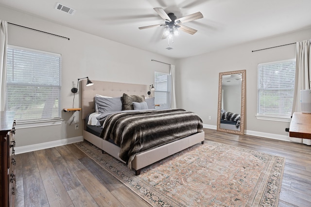 bedroom with ceiling fan and hardwood / wood-style floors