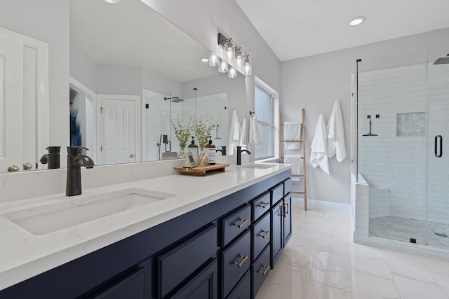 bathroom featuring an enclosed shower and vanity