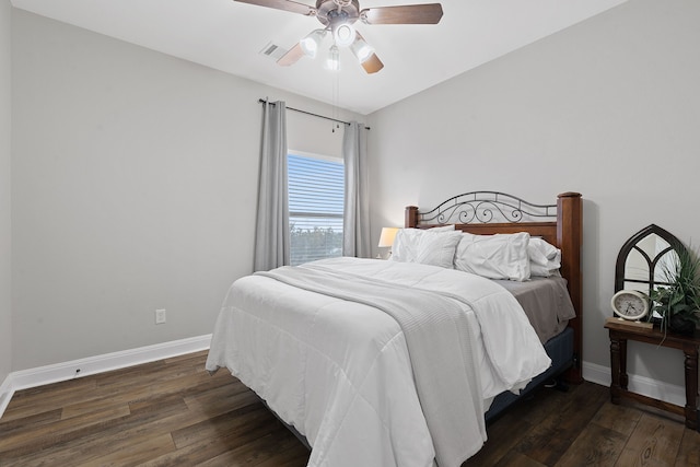 bedroom with ceiling fan and dark hardwood / wood-style floors