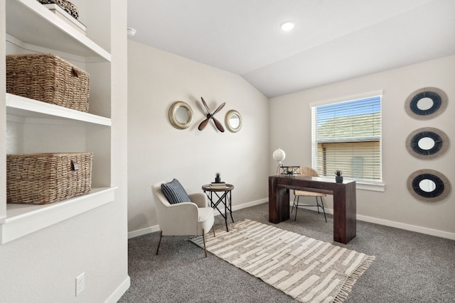 carpeted office featuring vaulted ceiling