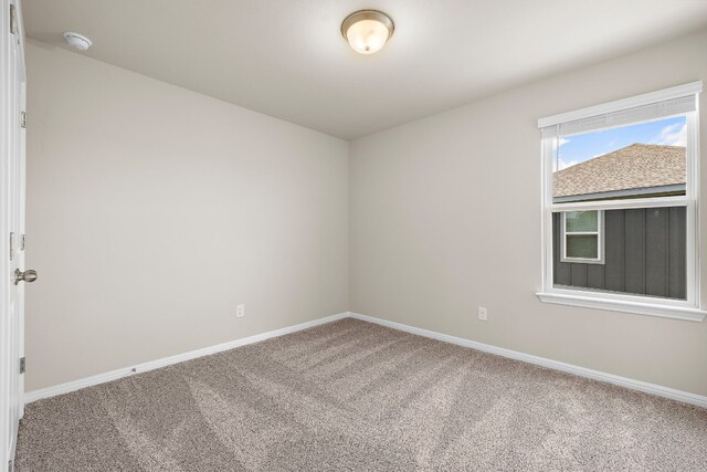 unfurnished room with carpet