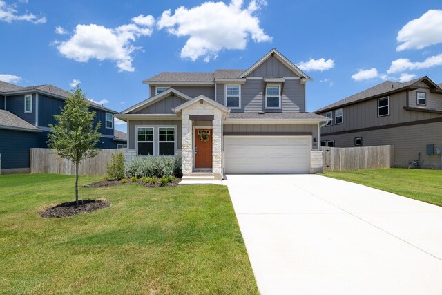 craftsman house with a garage and a front yard