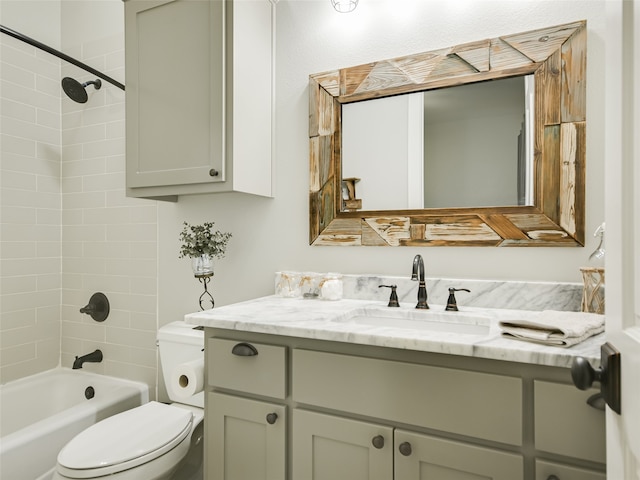 full bathroom featuring toilet, vanity, and tiled shower / bath combo