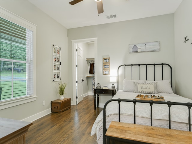 bedroom featuring dark wood-type flooring and ceiling fan