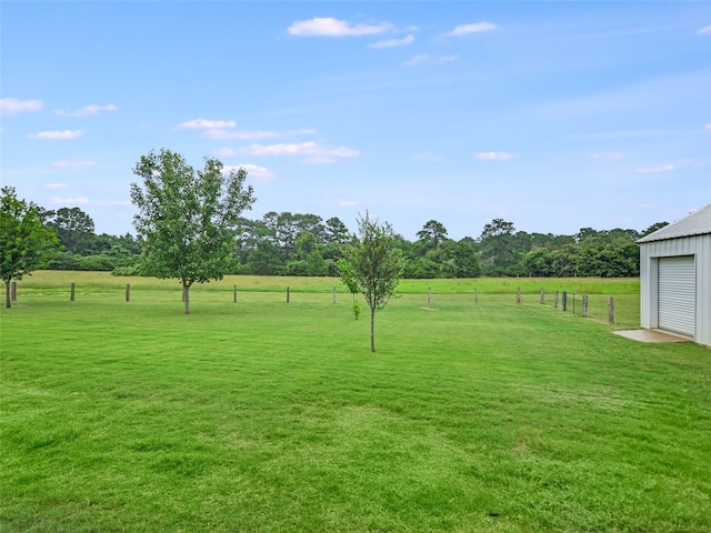 view of yard with a rural view