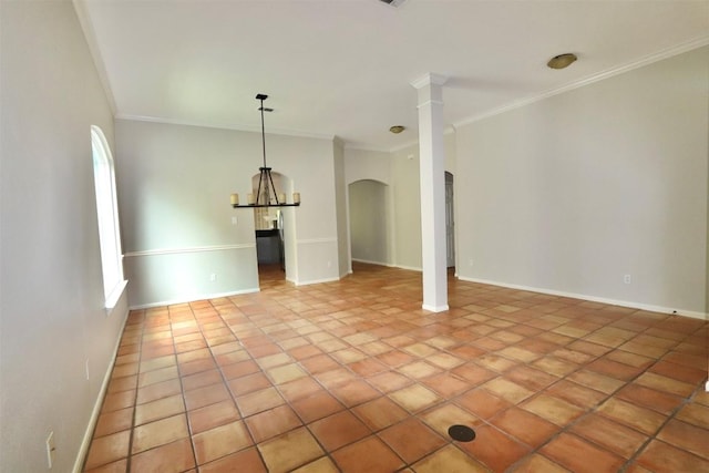 tiled empty room featuring crown molding