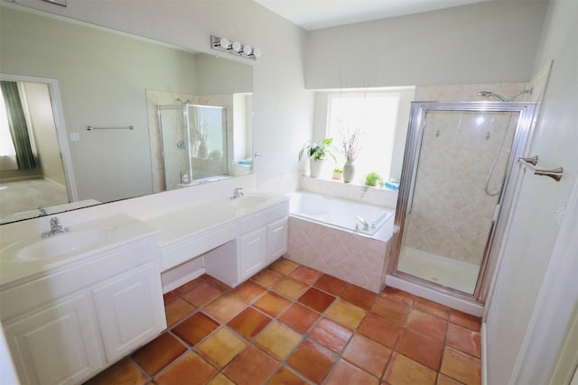 bathroom featuring tile patterned floors, vanity, and independent shower and bath