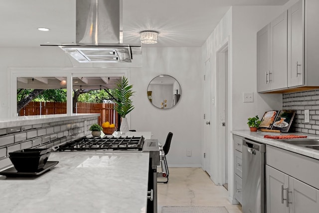 kitchen featuring stainless steel dishwasher, backsplash, and island exhaust hood