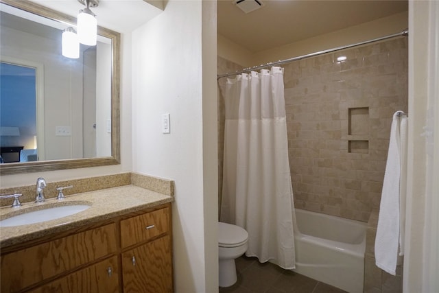 full bathroom featuring vanity, tile patterned floors, toilet, and shower / tub combo