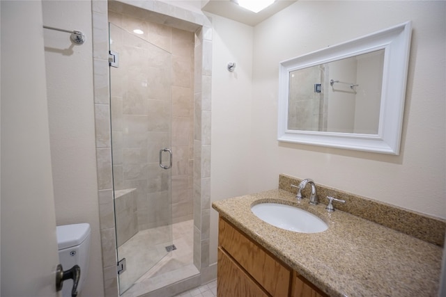 bathroom with walk in shower, vanity, and toilet