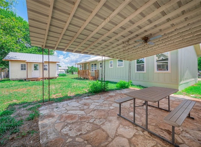 view of patio / terrace featuring a deck and ceiling fan