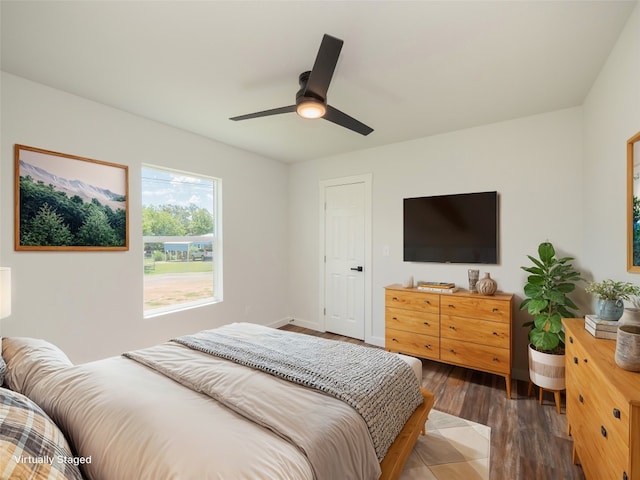 bedroom featuring dark hardwood / wood-style floors and ceiling fan