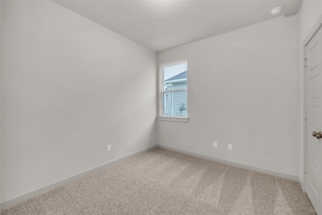 spare room featuring carpet flooring