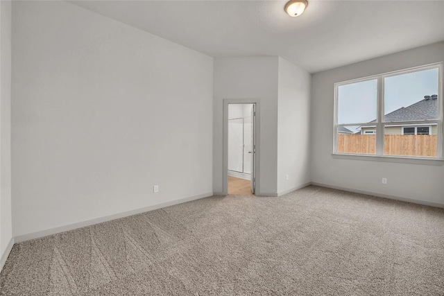 unfurnished bedroom with light carpet