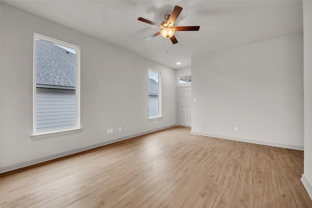 spare room with ceiling fan and light hardwood / wood-style floors