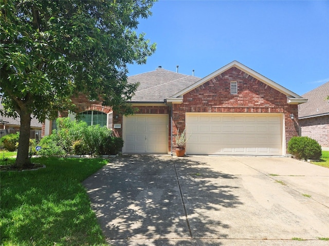 view of front facade featuring a garage and a front lawn