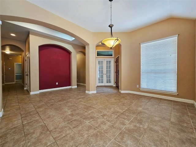 spare room with french doors and tile patterned flooring