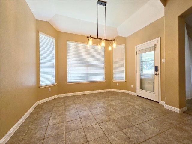 unfurnished dining area featuring tile patterned floors and lofted ceiling