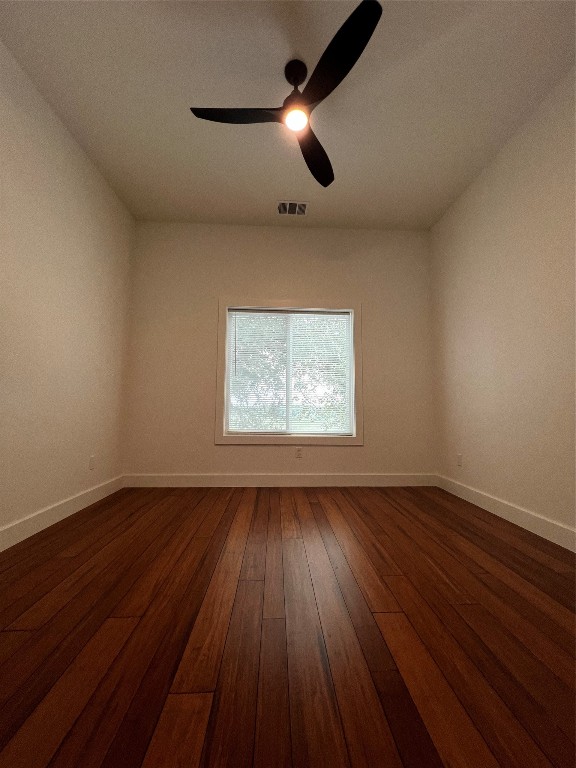 unfurnished room with wood-type flooring and ceiling fan