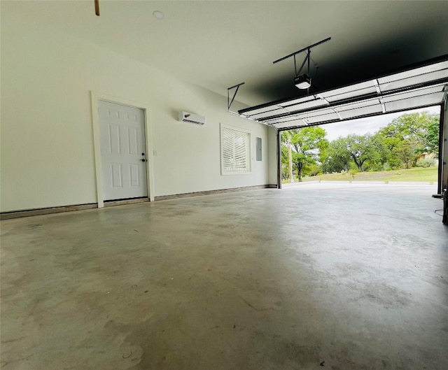 garage with a wall mounted air conditioner and a garage door opener