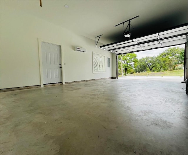 garage featuring a garage door opener and a wall mounted AC