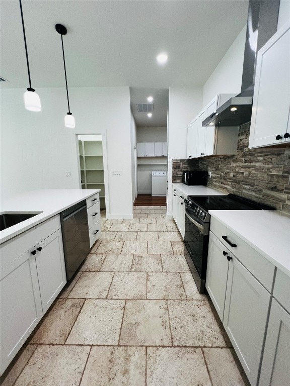 kitchen with black appliances, tasteful backsplash, wall chimney range hood, white cabinets, and light tile patterned floors