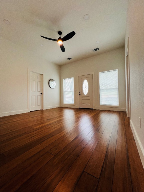 unfurnished room featuring hardwood / wood-style flooring and ceiling fan