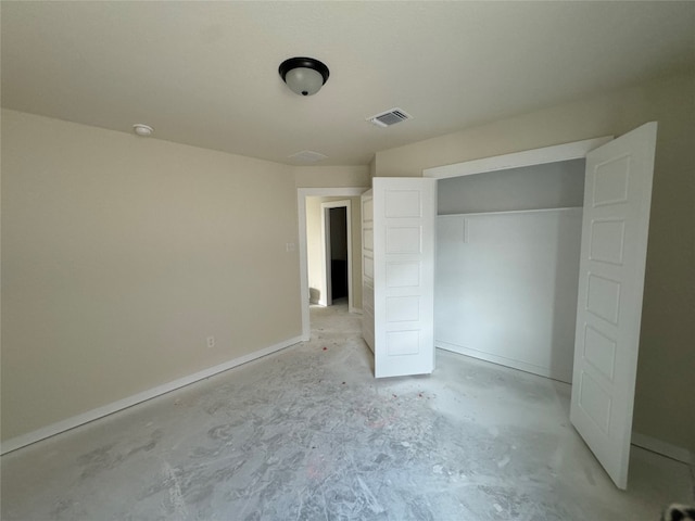 unfurnished bedroom with a closet