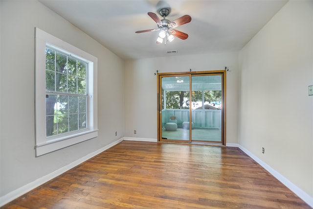 unfurnished room featuring ceiling fan and hardwood / wood-style floors