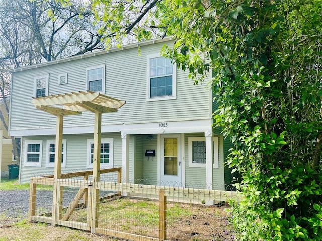 1005 Ellingson Ln, Austin, TX 78751 - view of front of home with a fenced front yard, covered porch, and a gate