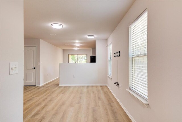 unfurnished room featuring light hardwood / wood-style flooring